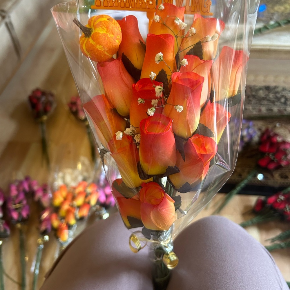 Wooden Roses last forever arranged in a bouquet with rose oil. They smell great.